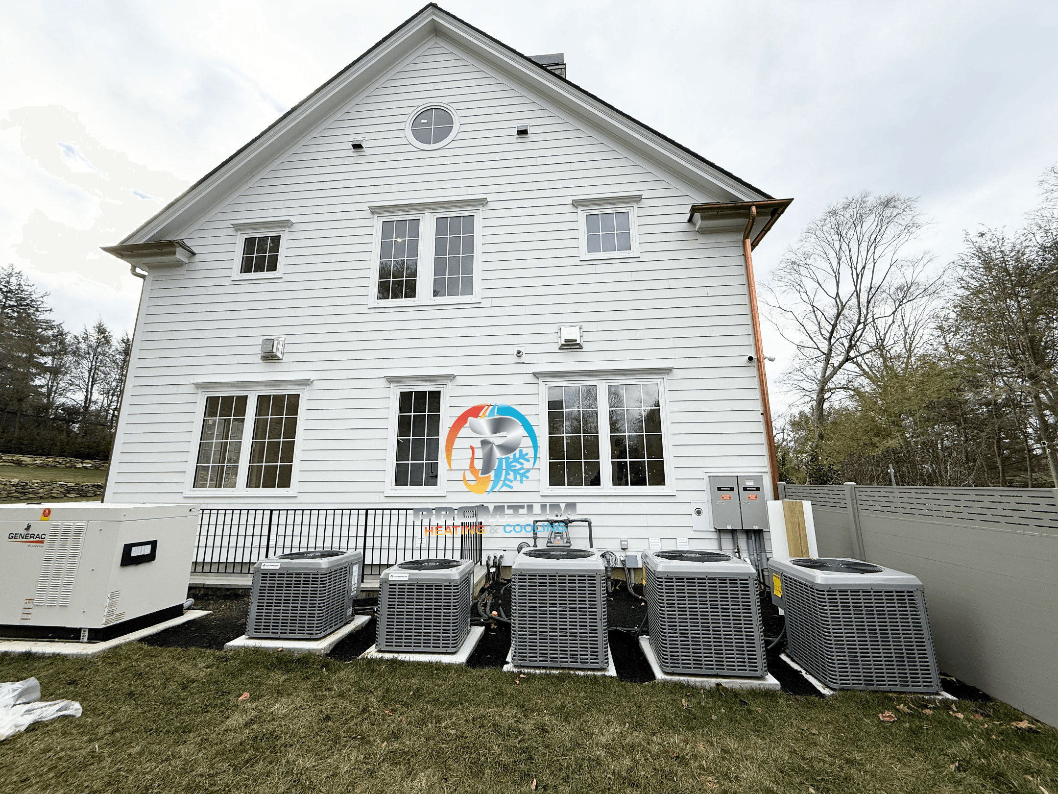 Multiple AC condensers and Generac generator installed on exterior pad